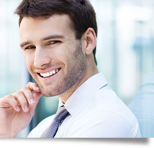 Confident man smiling after a smile makeover